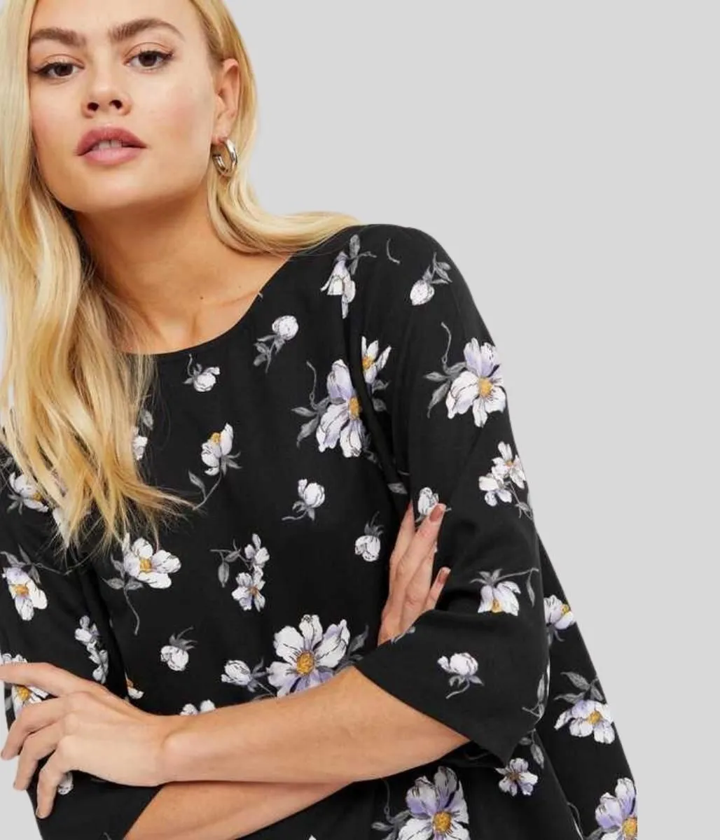 Black Floral Dipped Hem Top